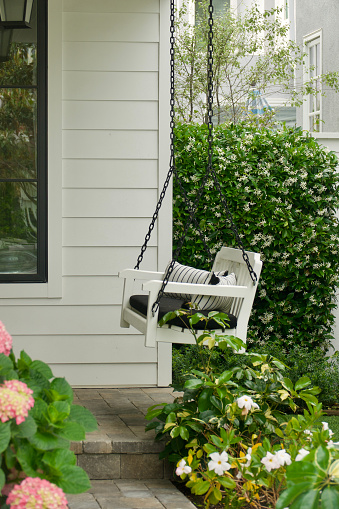 White wood swing on the front porch