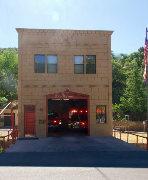 Vintage brick fire house with red doors
