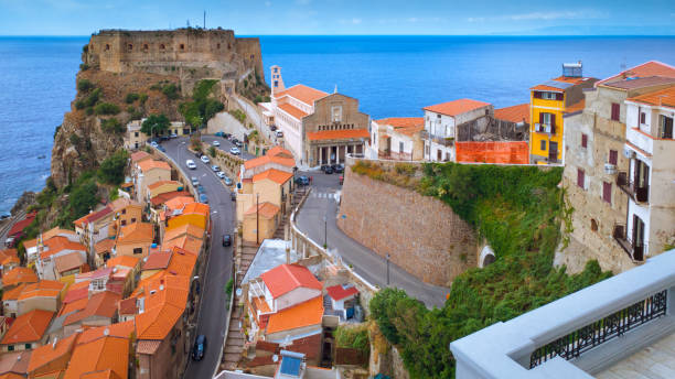 Scenic view with Ruffo castle, old town and blue sea on horizon. Scilla town, Southern Italy Scilla, Italy - September 10, 2019: Scenic view with Ruffo castle, old town and blue sea on horizon. castle scilla stock pictures, royalty-free photos & images