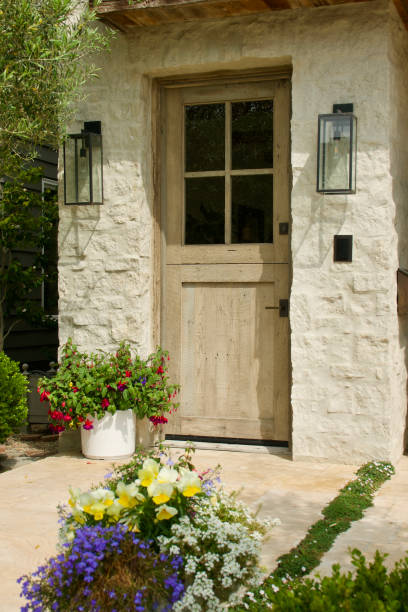 istock Limestone cottage with colorful garden 1499438896