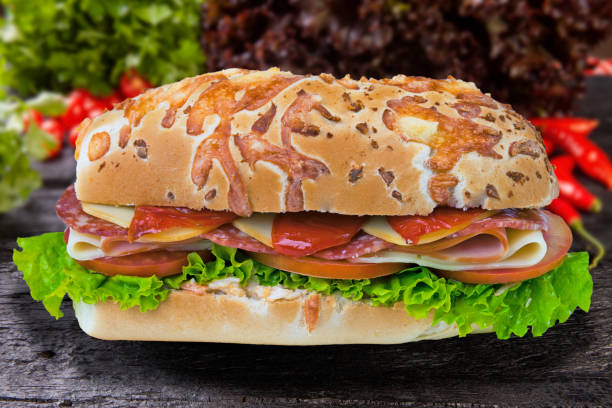 istock Sandwich with tomato, mozzarella, lettuce, salami 1499444074