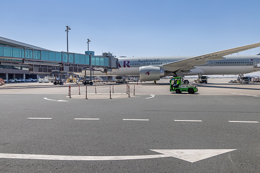 Hamad International Airport, Doha, Qatar - March 30th 2023: parked Boeing 777 on the tarmac