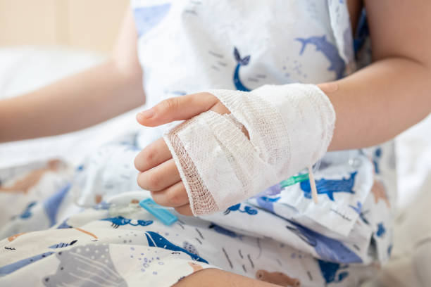 istock Close up child hand with saline IV solution in hospital 1499450749