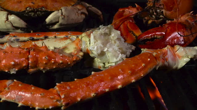 King Crab Legs and Dungeness Crab on the Grill with Butter