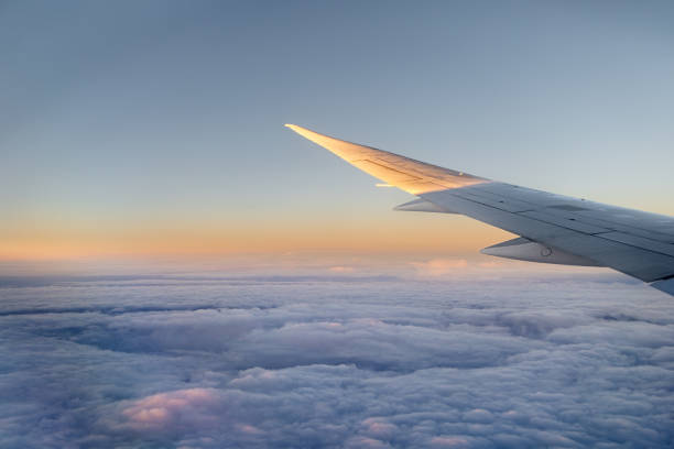 istock Wing of a Boeing 777 over the clouds 1499457210