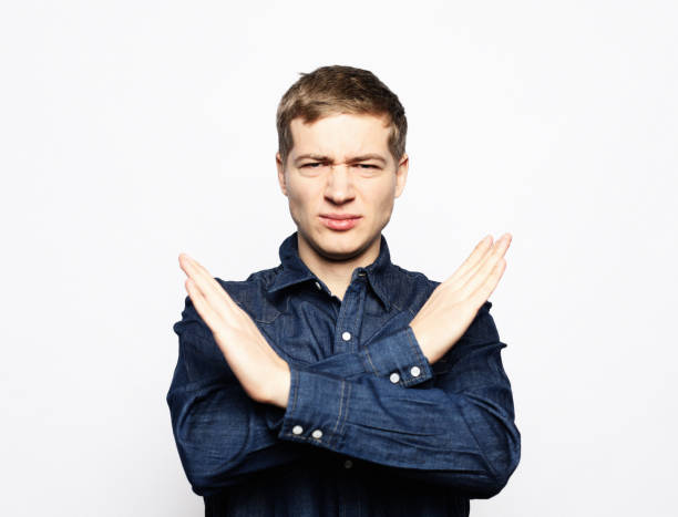 istock emotion and people concept: Man making time out gesture 1499458878
