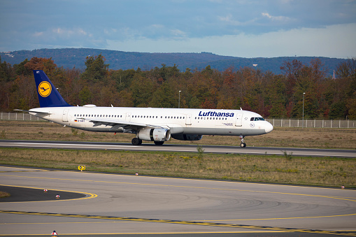 Passenger airplane Airbus A 321 from Lufthansa departing from  germanys biggest airport. Frankfurt Airport, Germany