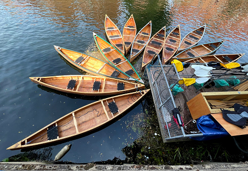 Empty rowing boats on the River Wensum in Norwich
