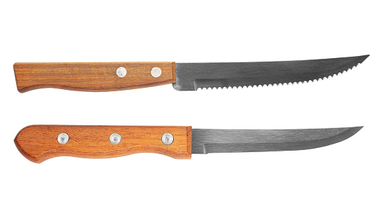 Kitchen knife and steak knife with wooden handle Isolated on white background. File contains clipping path