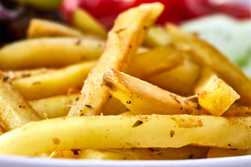 French fries, on a plate, macro view