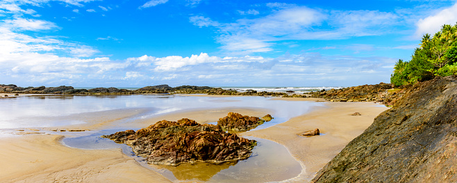 Panoramic image of beautiful Prainha beach located in Serra Grande in Bahia and surrounded by rocks and vegetation