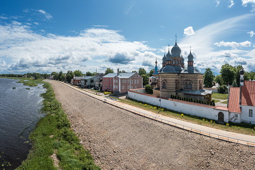 The left bank of the city of Jekabpils, a view from a drone. In the foreground is the Orthodox Church of the Holy Spirit