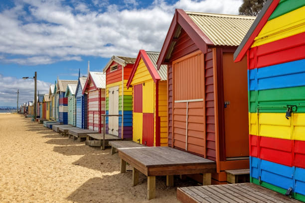 Brighton beach Victorain bathing boxes. Brightly painted colourful beach huts line the sand in Melbourne, Australia. They are highly desirable and extremely expensive real estate. Brighton beach Victorain bathing boxes. Brightly painted colourful beach huts line the sand in Melbourne, Australia. They are highly desirable and extremely expensive real estate. traditionally australian stock pictures, royalty-free photos & images