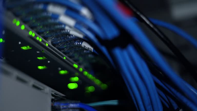 Close up blurry storage server LED light in dark data center rack.