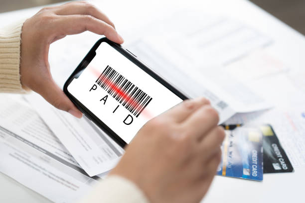 istock A person using smart phone scanning bill to make online payment service 1499485609