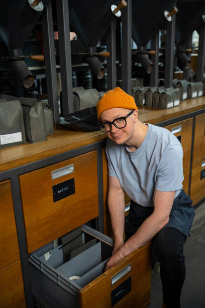 istock Barista preparing coffee, coffeemaker pouring beams for brewing energy beverage. 1499487579