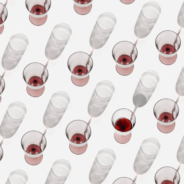 istock Minimal pattern with glasses of red wine with sunlight shadows, Creative idea summer flat lay with empty Wine glasses and one full on white, layout alcohol drinks, trend aesthetic photo 1499492034