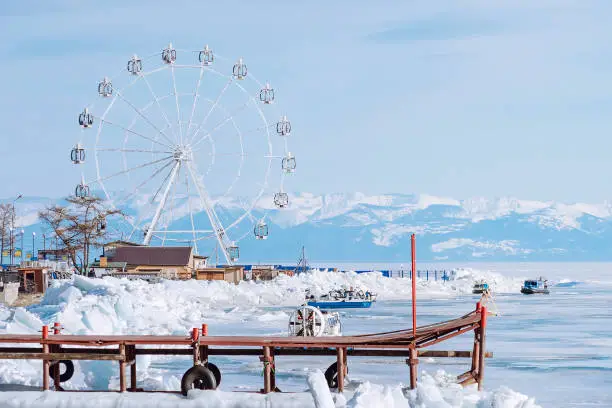 Lake Baikal in early spring. The village of Listvyanka is a popular travel destination. High quality photo