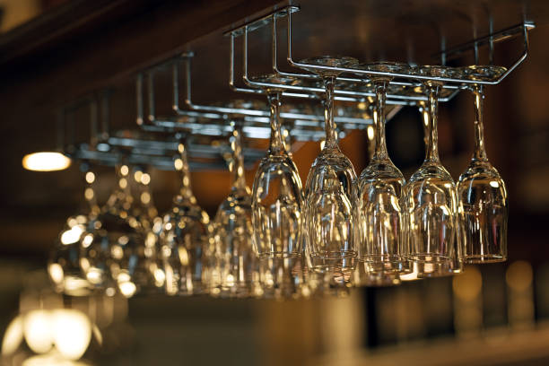 istock Wine glasses hanging in a bar 1499494324
