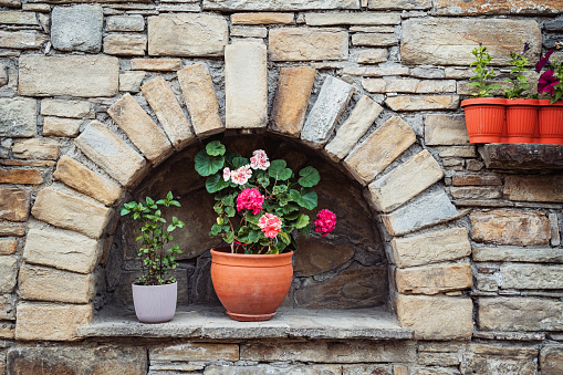 Flower pots on stone building