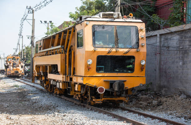Maintenance railway on working a track tamping machine works on the tracks