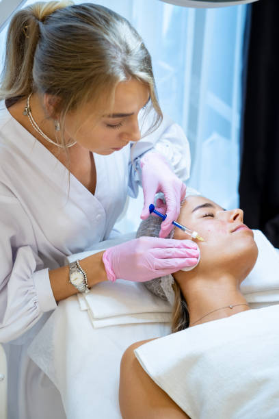 istock Cosmetologist doing PRP ttherapy in beauty clinic, making injection. 1499495137