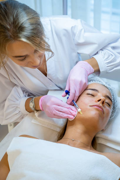 istock Cosmetologist doing PRP ttherapy in beauty clinic, making injection. 1499495140