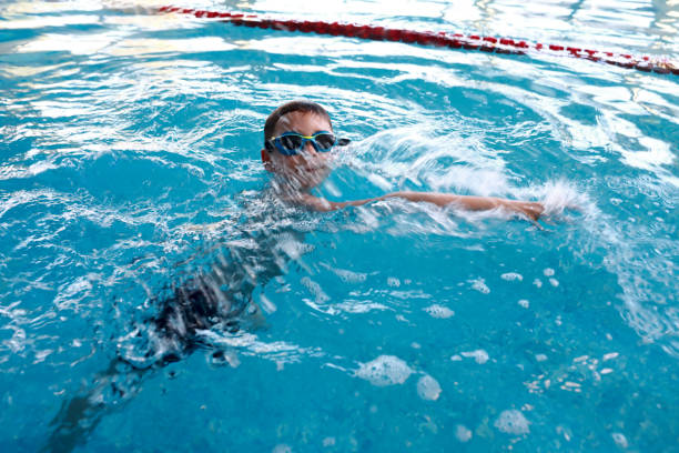 istock Child swimming in the pool 1499495505