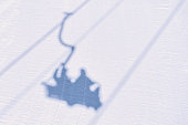 shadow of a skier on a skilift