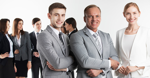 Portrait of male business executives smiling isolated over white background