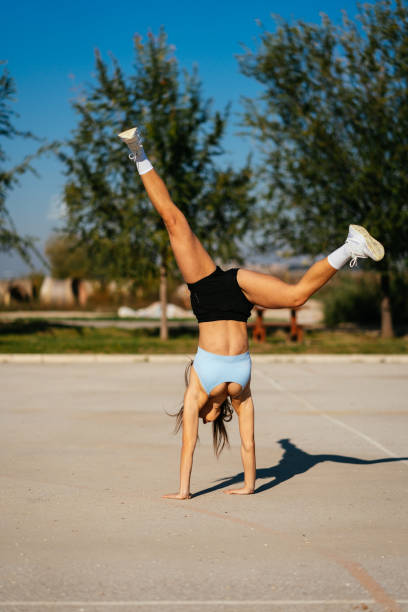 istock Flexible girl standing on her hands 1499497631