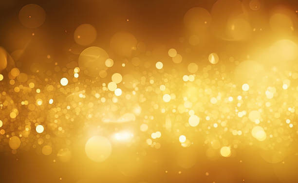 istock Gold glitters background. shimmering blur spot lights Bokeh Shiny gold light background texture 1499501033