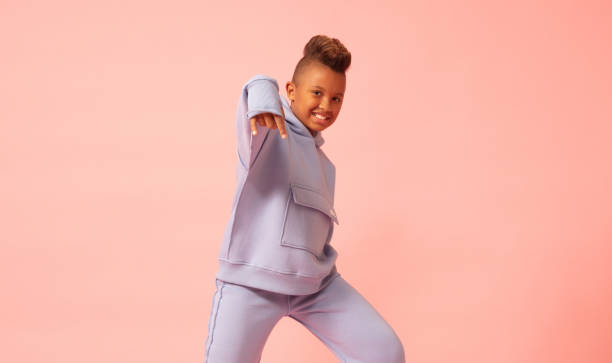 istock Little boy posing as a rapper with a punk haircut. 1499501377