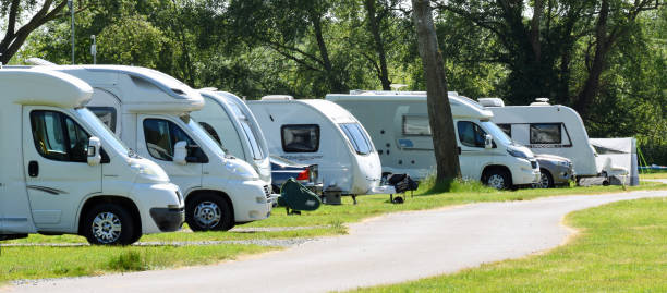 St Neots, Cambridgeshire, England - June 08, 2023: Camper Vans and Caravans in a row on camp site