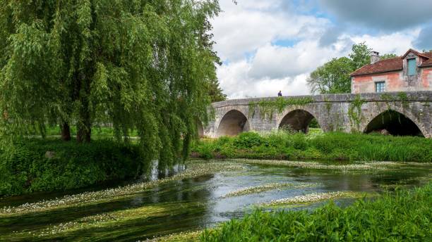 Ancient stone bridge in French village stock photo