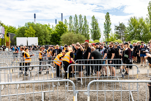 Copenhagen, Denmark - June 15, 2023: Security people check visitors of the Copenhell Festival