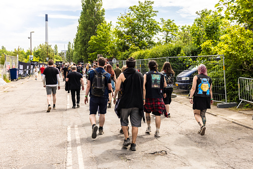 Copenhagen, Denmark - June 15, 2023: Visitors of  the Copenhell Festival on their way to the entrance.