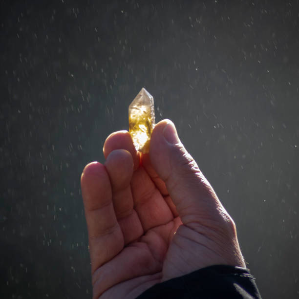 istock Miner holding a yellow quartz crystal ( Citrine Quartz ) 1499505614