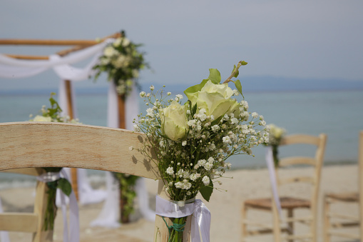 Outdoor beach wedding ceremony set up, beach wedding venue, no people, simple boho style