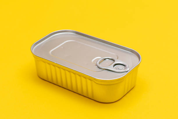 istock Unopened Tin Can with Blank Edge on Yellow Background 1499514464