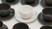 Group of 3D Black Cups and White Cup on the center on white background