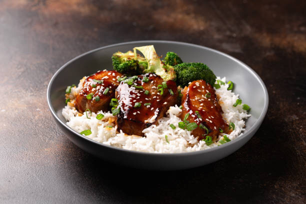 Teriyaki Pork Belly with broccoli, spring onion and rice Teriyaki Pork Belly with broccoli, spring onion and rice. sticky sesame chicken sauces stock pictures, royalty-free photos & images