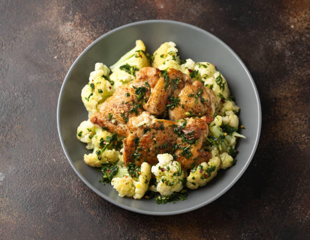Homemade Chimichurri Chicken thighs with cauliflower. Healthy food