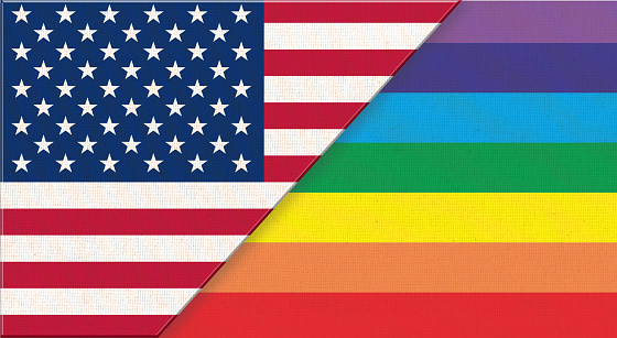 Flag of USA and sexual diversity. American flag and Rainbow colors. Symbol of lgbt community on fabric surface. National symbol of United States of America with sexual minorities multicolored flag
