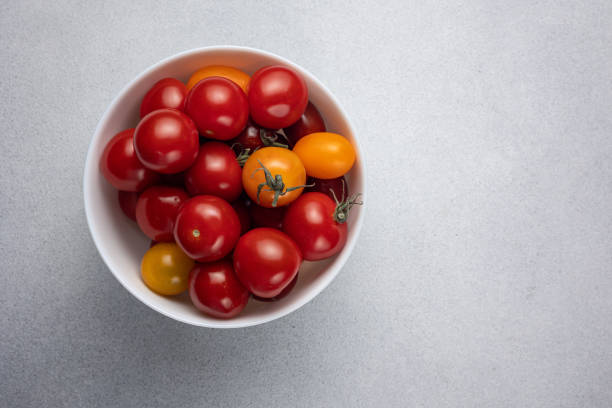 istock Red tomatoes in the background. Close up 1499520101
