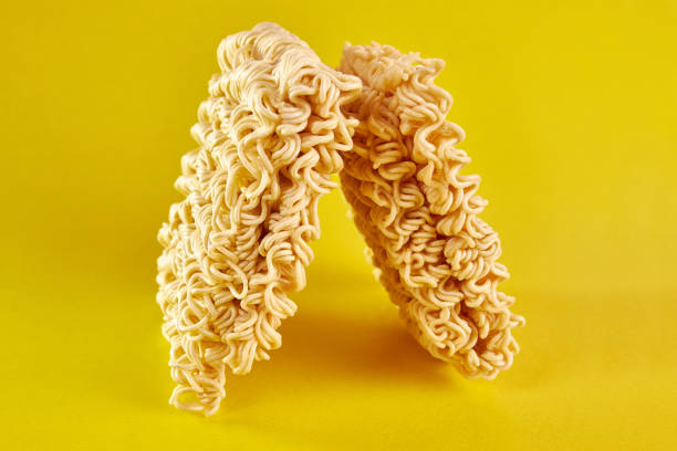 istock Instant vermicelli on a yellow background. Instant food. 1499520340