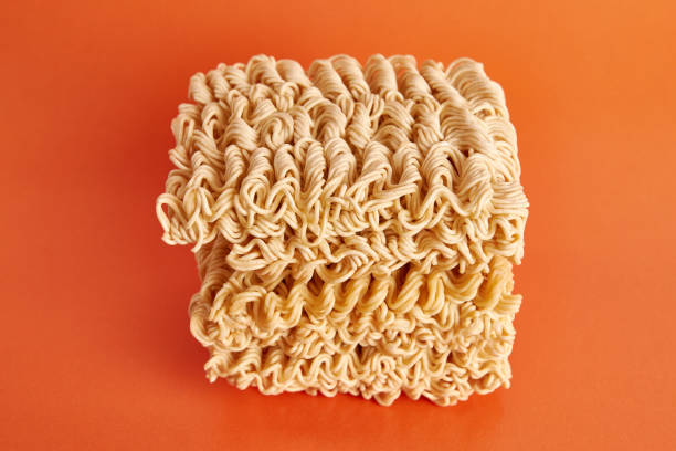 istock Instant vermicelli on an orange background. Instant food. 1499520420