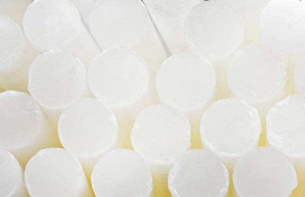 istock abstract background from round white paraffin candles. 1499520542
