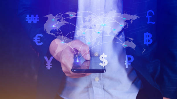 istock Businessman using mobile phone and laptop computer to money transfers and currency exchanges between countries of the world, online banking interbank payment concept. 1499520677