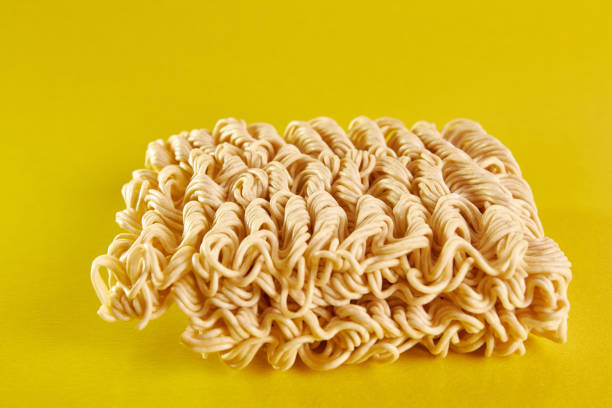 istock Instant vermicelli on a yellow background. Instant food. 1499520743